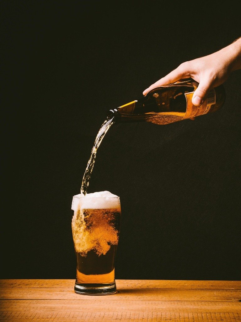 Beer being poured into a glass — craft beer at Tonique