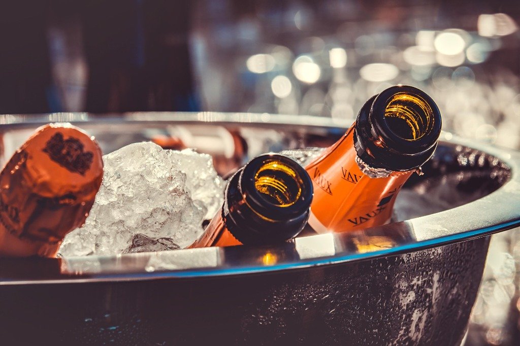 Champagne bottles chilling in an ice bucket