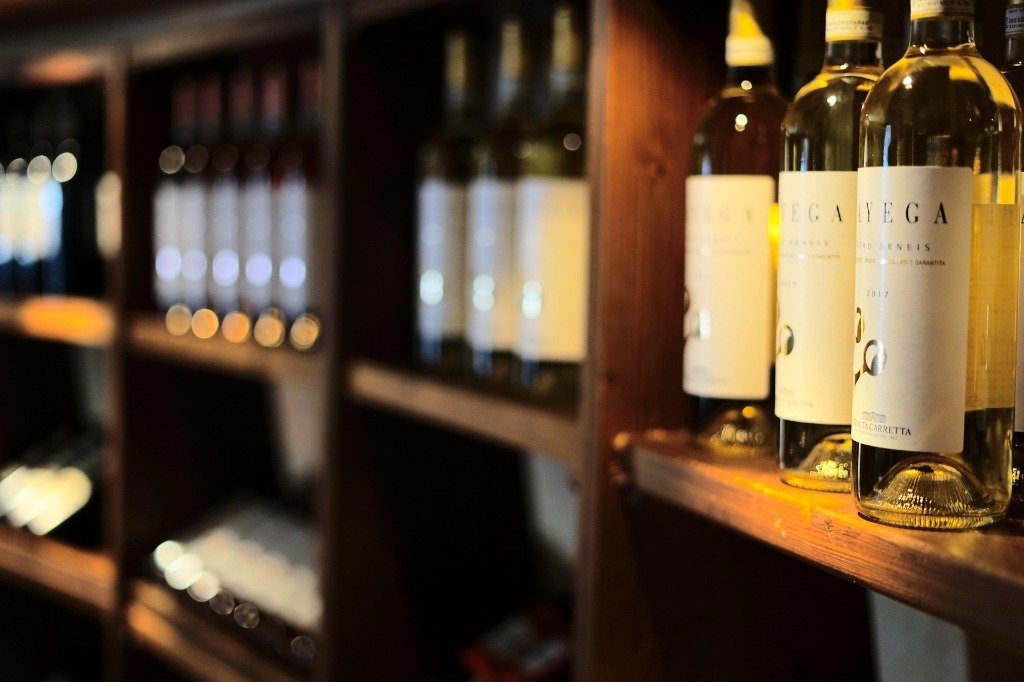 Tonique Koramangala — wine cellar shelves with curated bottles